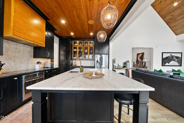 a kitchen with a table and chairs in it