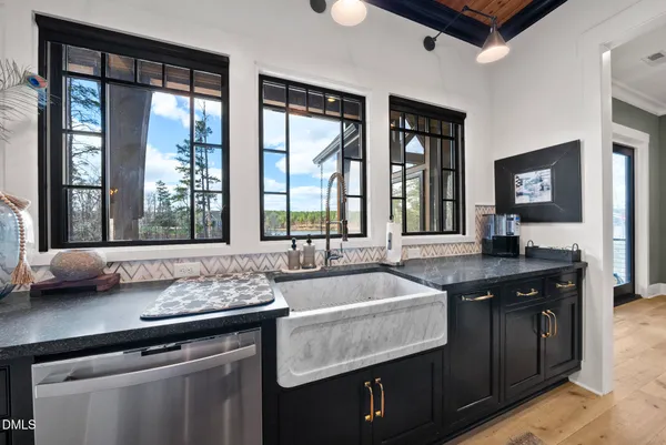 a kitchen with a sink and a window