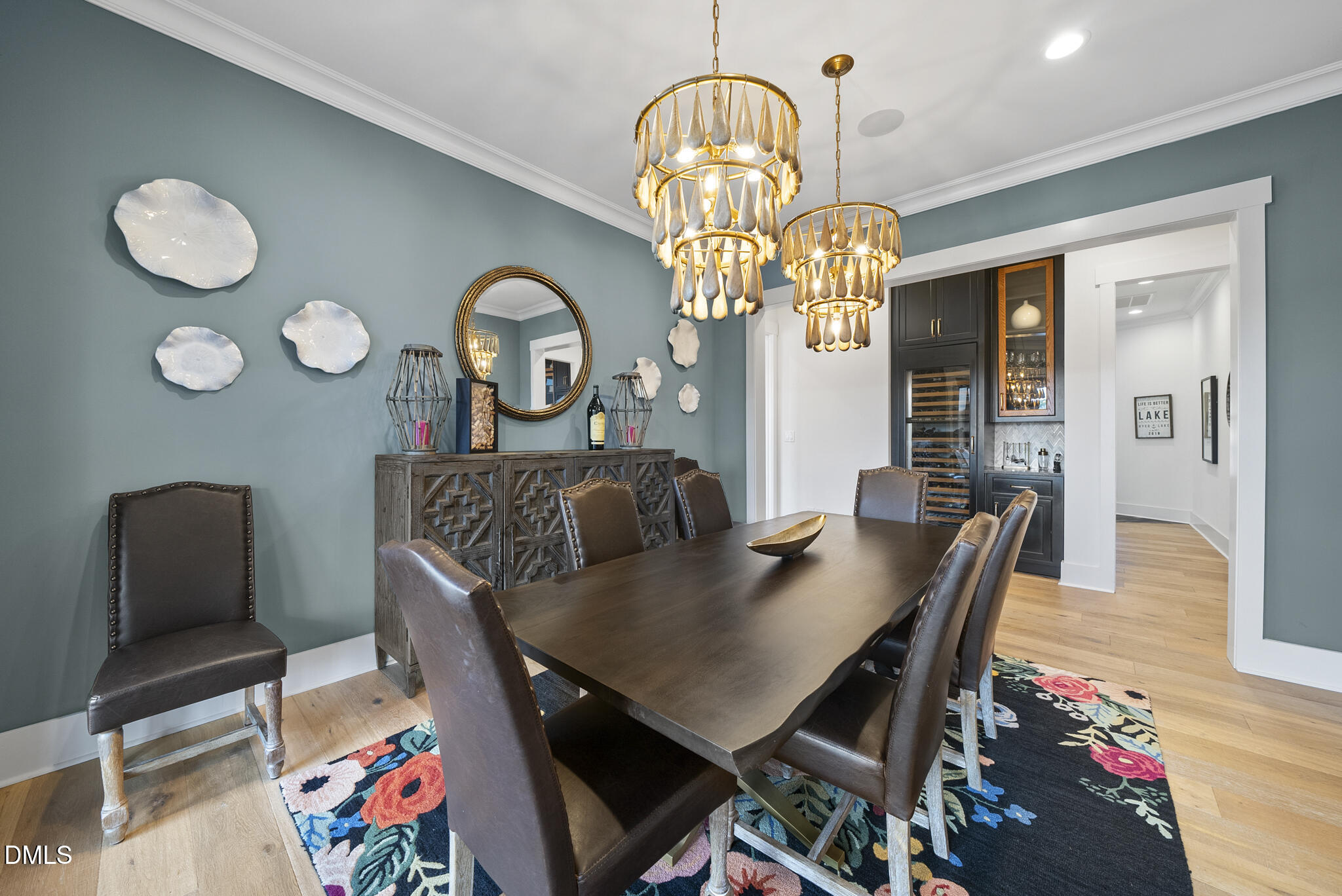 935 Estate Road Semora, NC 27343 - Photo 18 of 75 a view of a dining room with furniture a chandelier and wooden floor