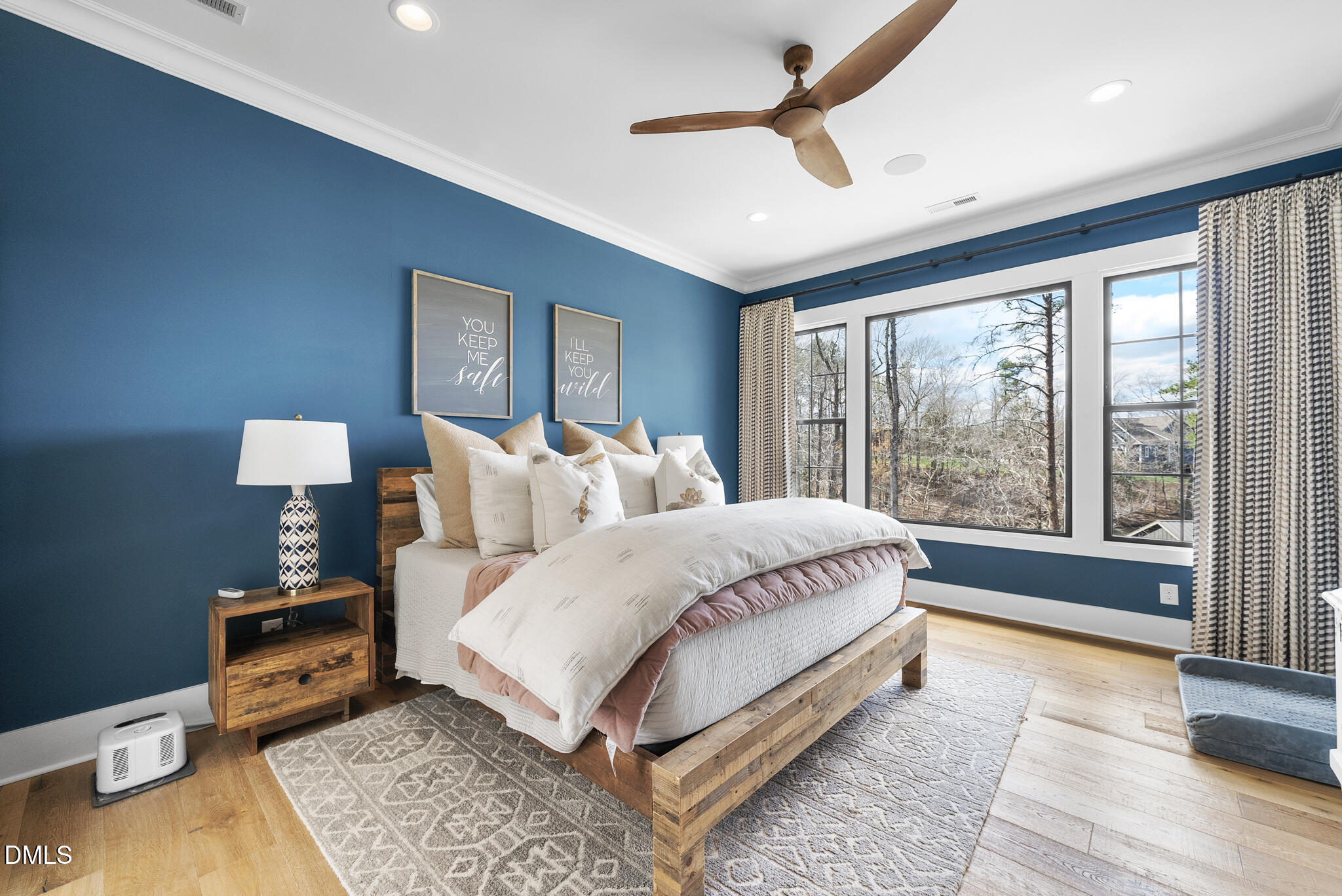 935 Estate Road Semora, NC 27343 - Photo 35 of 75 a spacious bedroom with a bed and a large window