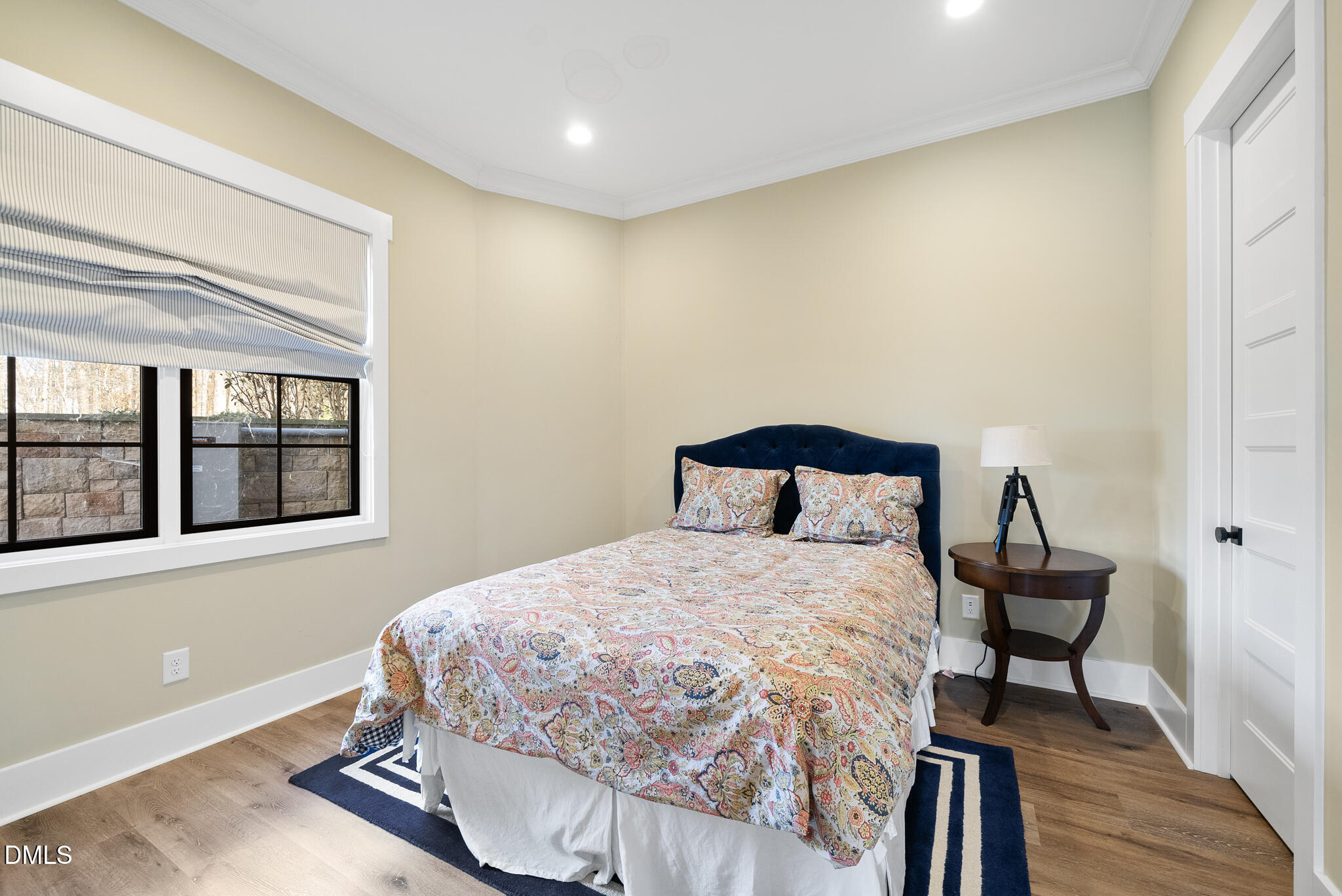 935 Estate Road Semora, NC 27343 - Photo 51 of 75 a bedroom with a bed and wooden floor
