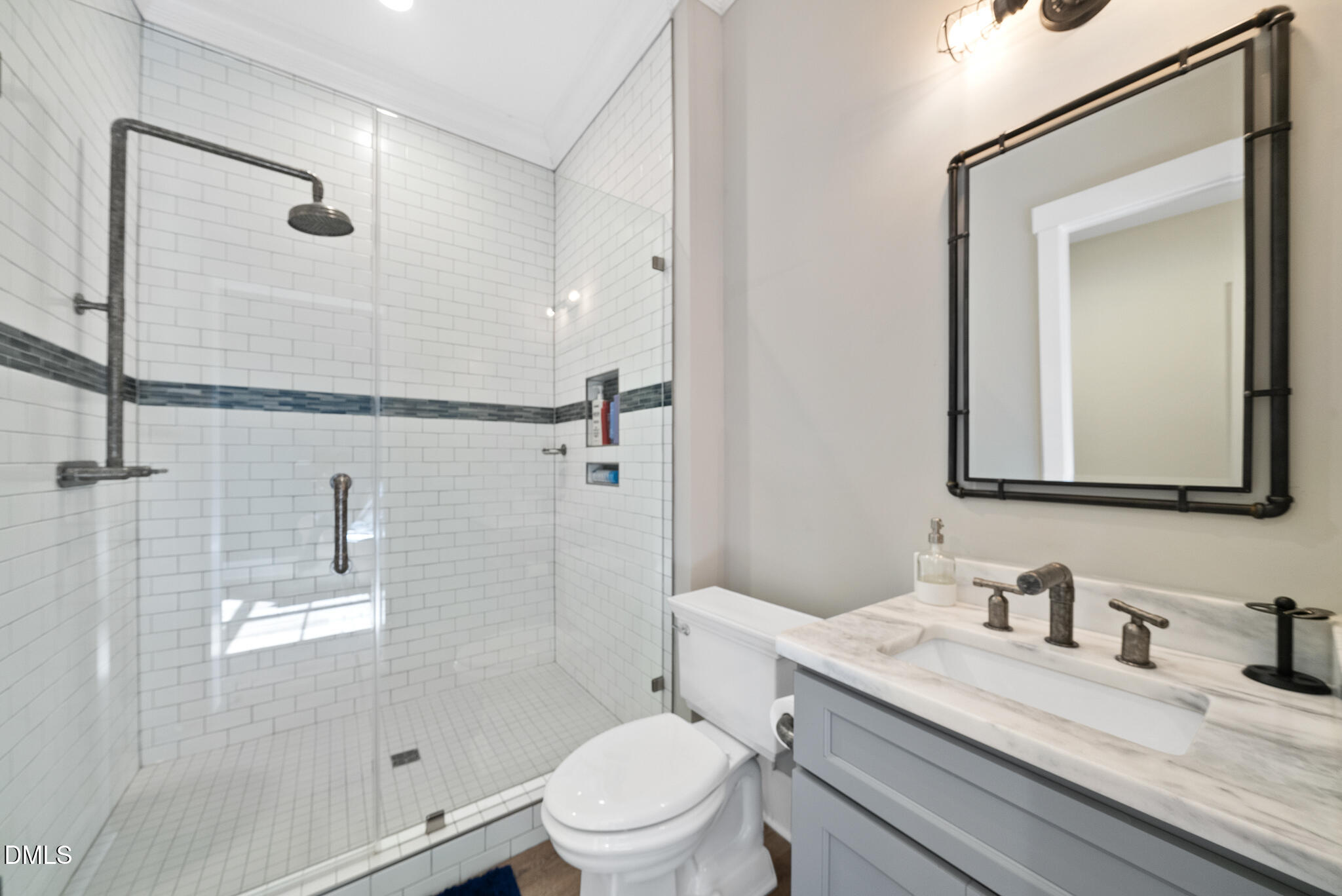 935 Estate Road Semora, NC 27343 - Photo 53 of 75 a bathroom with a granite countertop sink toilet a mirror and shower