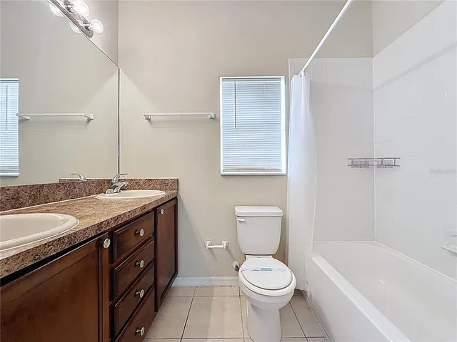 an empty room with a ceiling fan