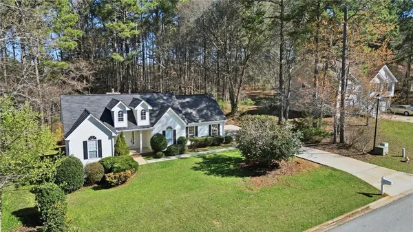 a front view of a house with a yard