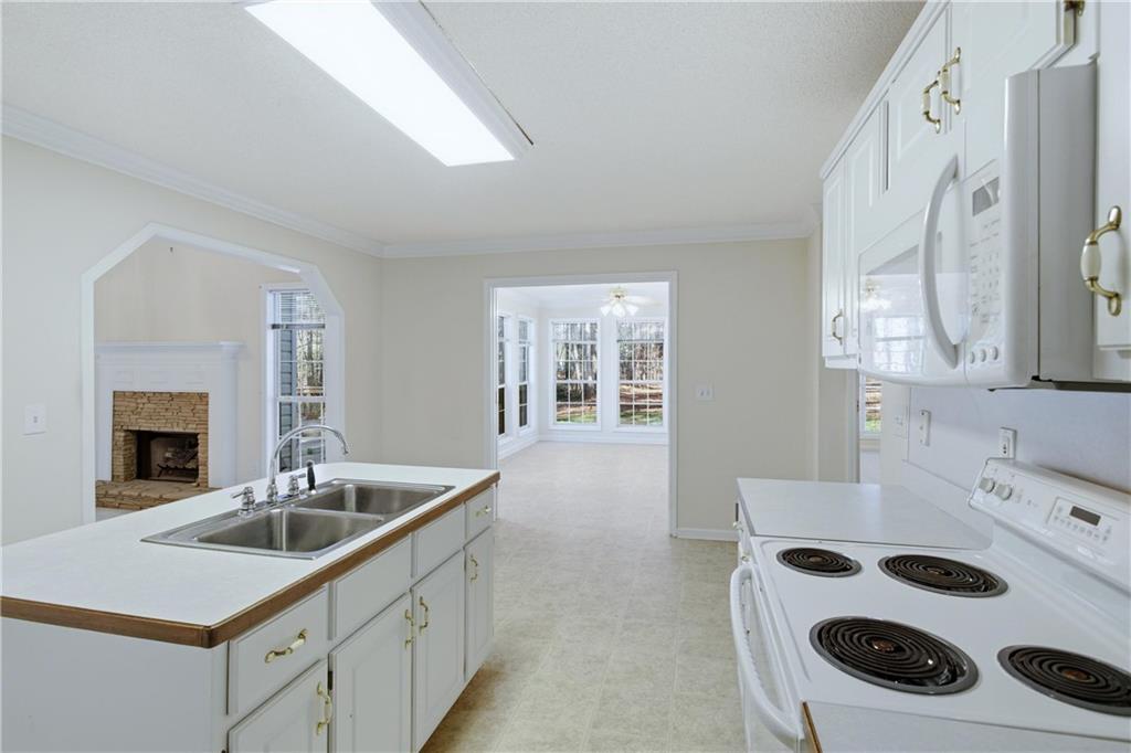 190 Cambridge Way Covington, GA 30016 - Photo 12 of 51 a kitchen with a sink stove and cabinets