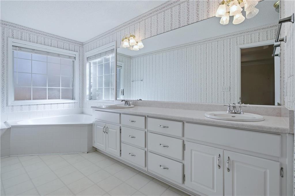 190 Cambridge Way Covington, GA 30016 - Photo 22 of 51 a bathroom with double sink and a mirror