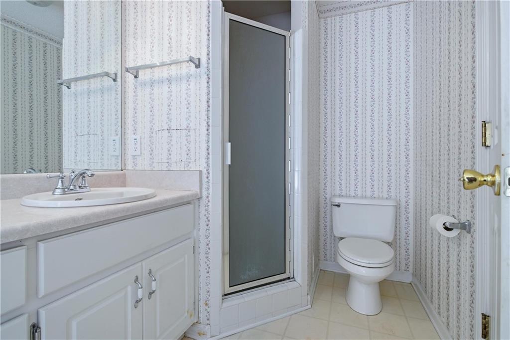 190 Cambridge Way Covington, GA 30016 - Photo 24 of 51 a bathroom with a toilet a sink and shower