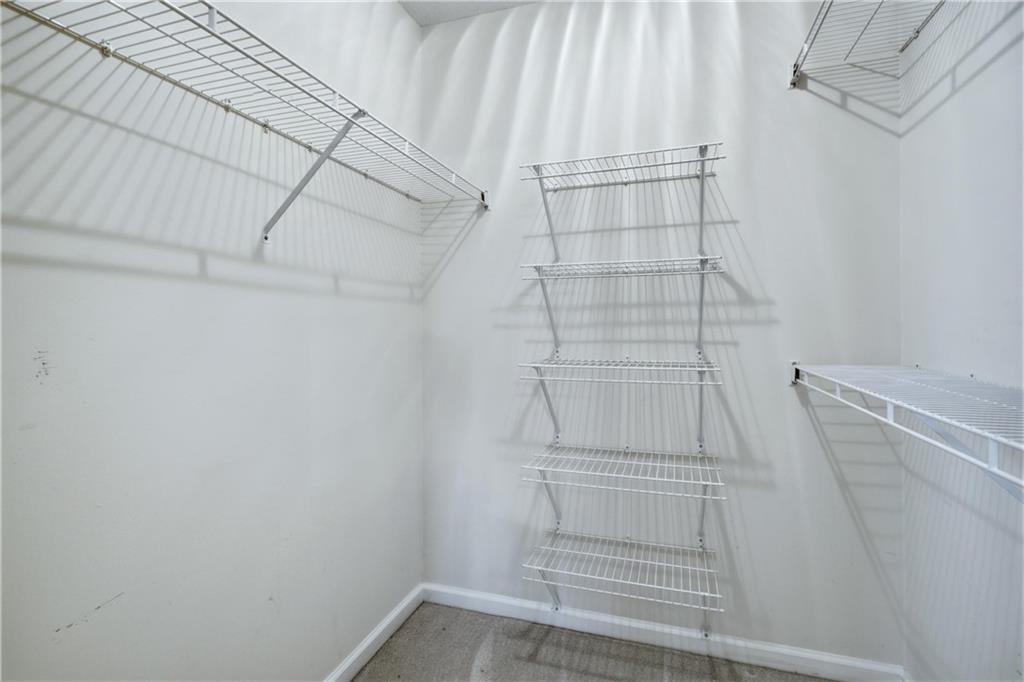 190 Cambridge Way Covington, GA 30016 - Photo 25 of 51 a view of walk in closet with empty racks