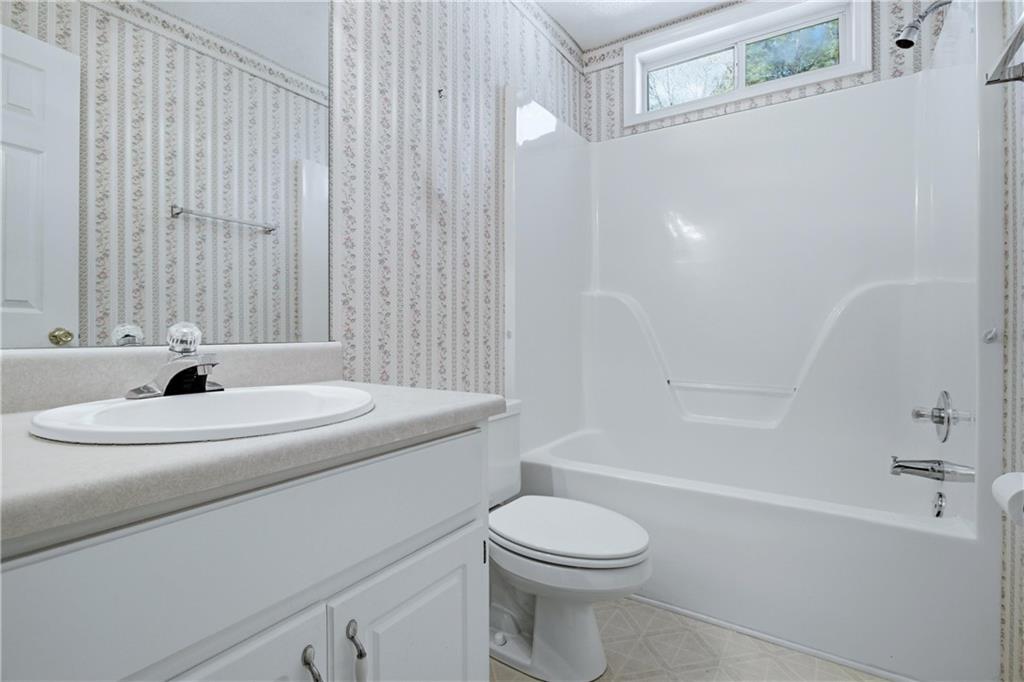 190 Cambridge Way Covington, GA 30016 - Photo 28 of 51 a bathroom with a sink a toilet and shower