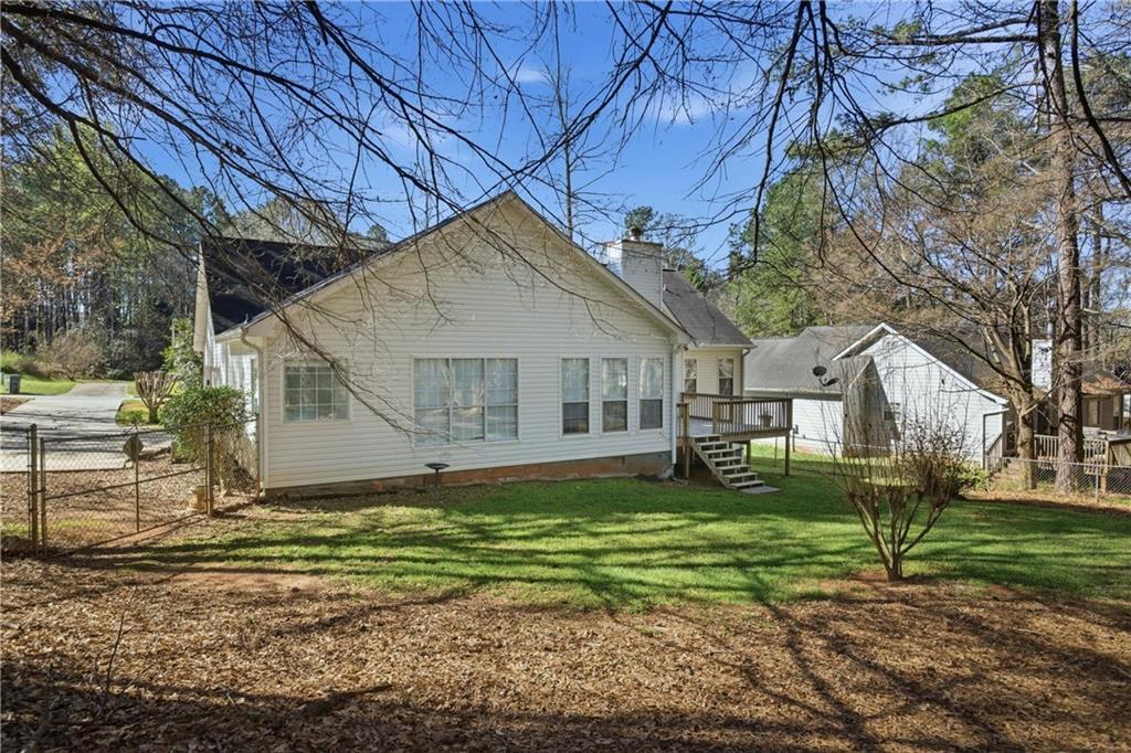 190 Cambridge Way Covington, GA 30016 - Photo 33 of 51 a house that has a big yard with large trees