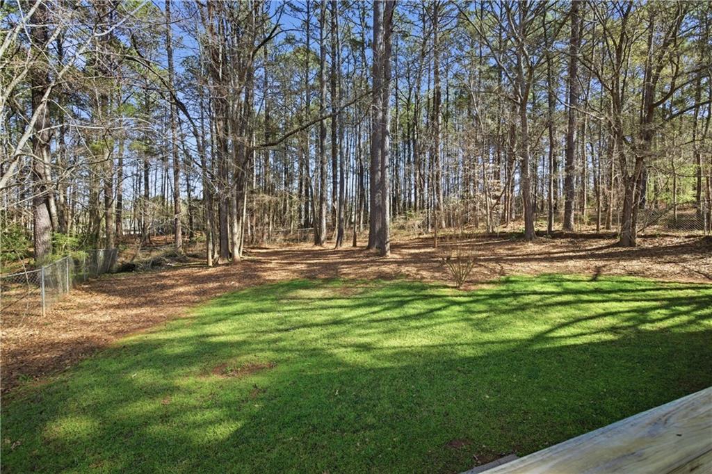 190 Cambridge Way Covington, GA 30016 - Photo 40 of 51 a view of outdoor space with deck and tree