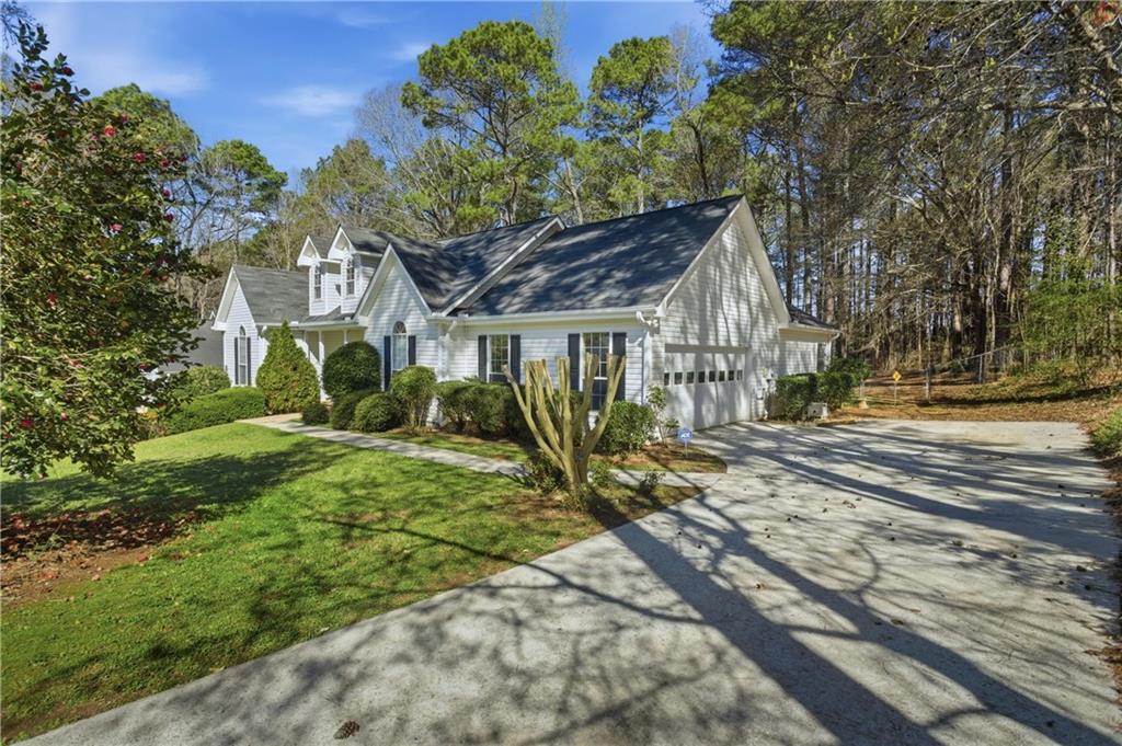 190 Cambridge Way Covington, GA 30016 - Photo 44 of 51 a house with a tree in front of it
