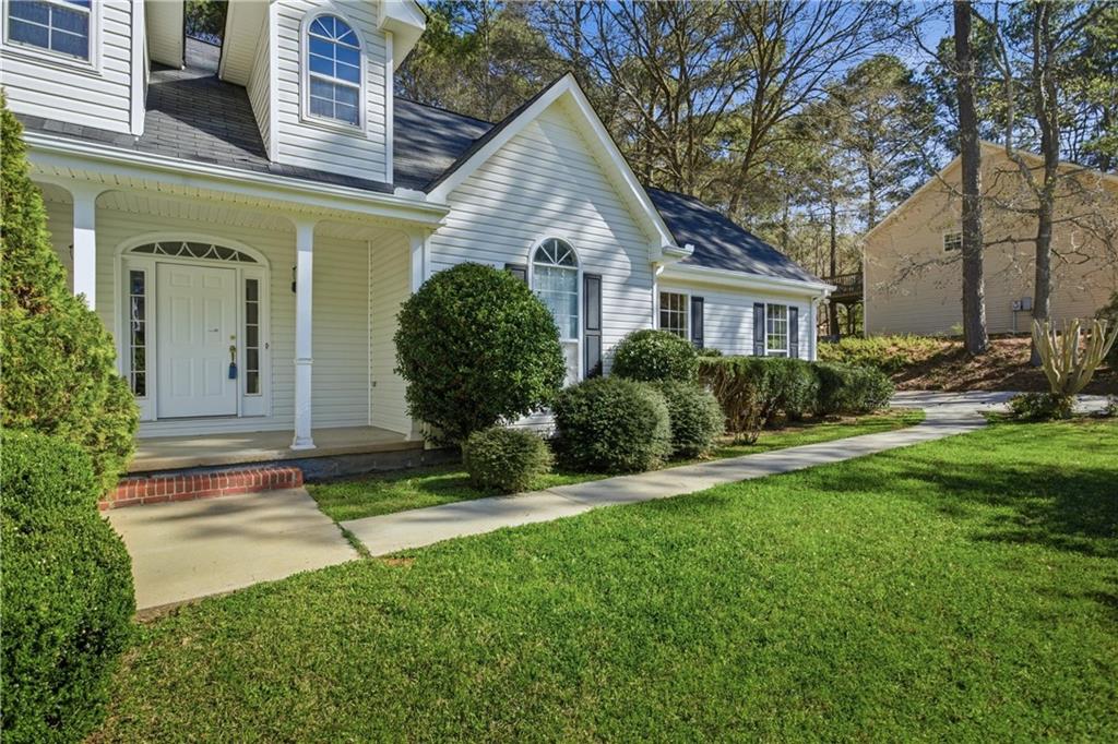 190 Cambridge Way Covington, GA 30016 - Photo 5 of 51 a front view of a house with garden