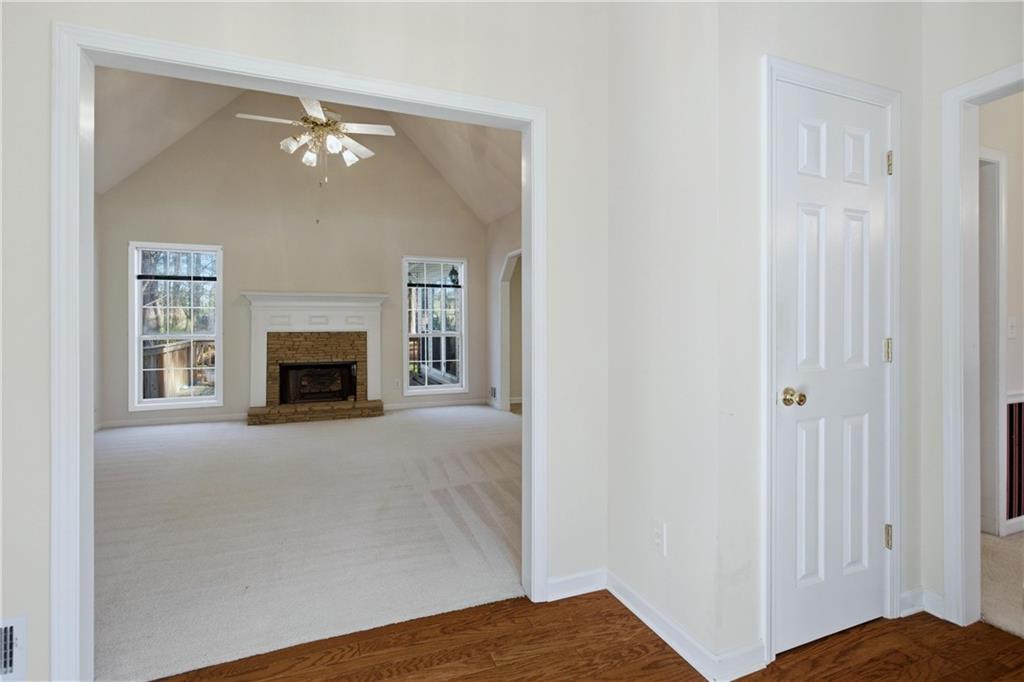 190 Cambridge Way Covington, GA 30016 - Photo 7 of 51 a view of empty room with fireplace and fan