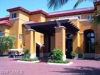 221 9th Street South, Unit 224 Naples, FL 34102 - Photo 1 of 8 a front view of a house with a yard