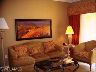 221 9th Street South, Unit 224 Naples, FL 34102 - Photo 7 of 8 a living room with furniture and a painting