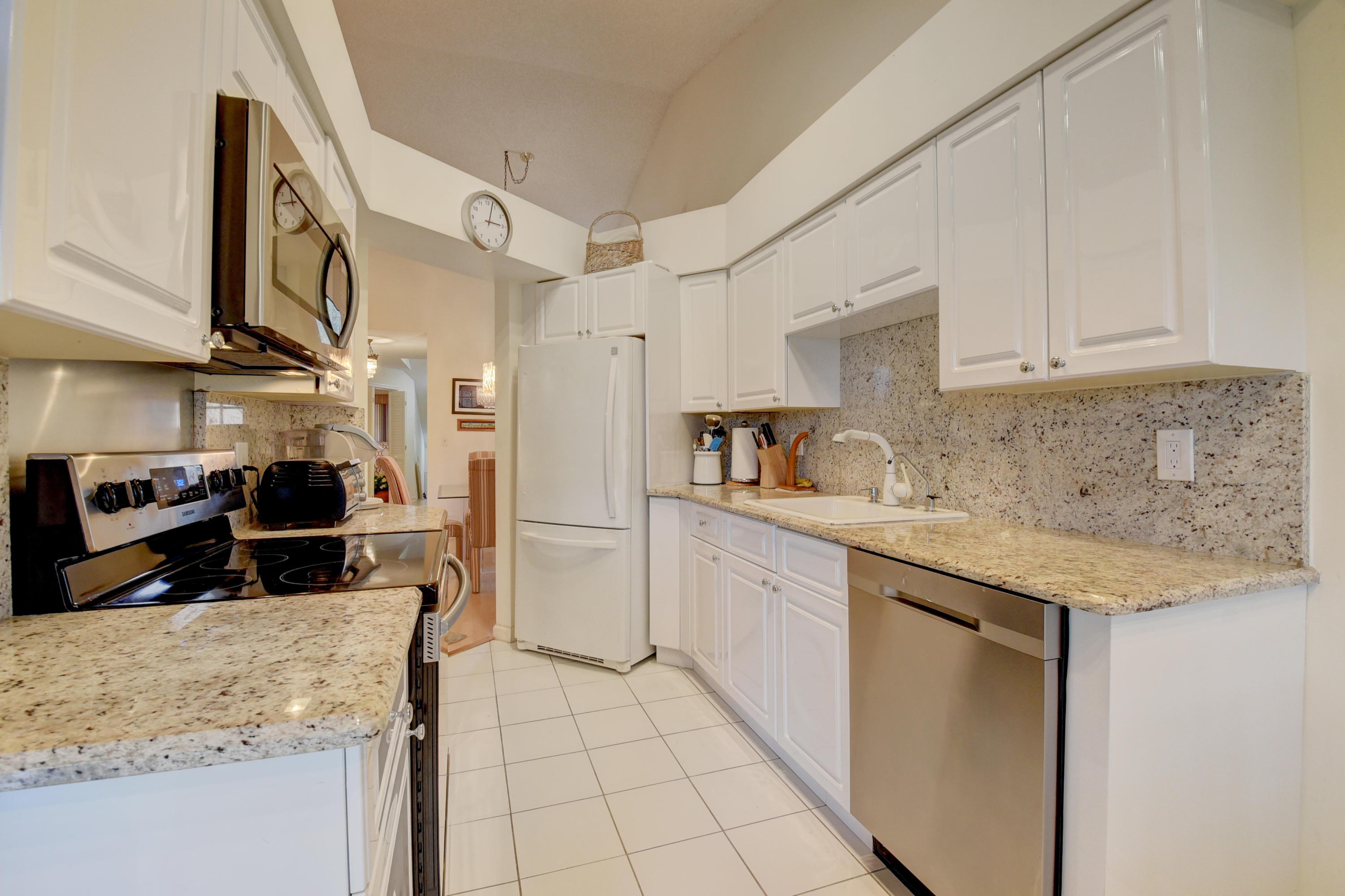 17380 Boca Club Boulevard, Unit 307 Boca Raton, FL 33487 - Photo 8 of 28 GRANITE COUNTERS & FULL BACKSPLASH