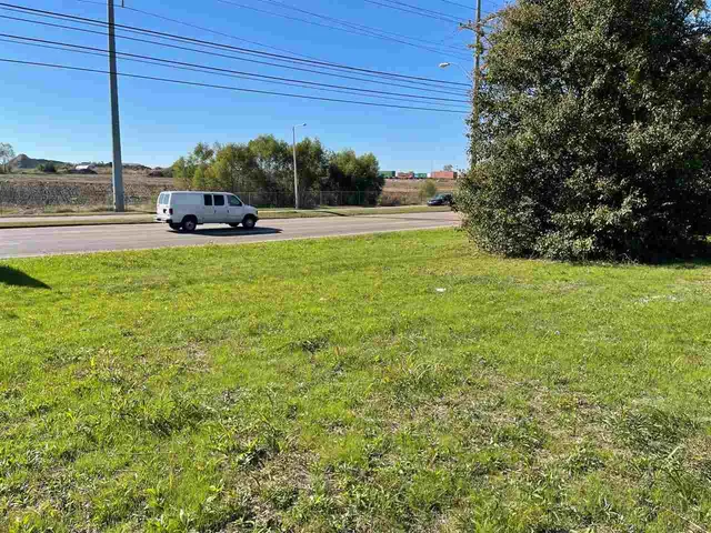 a view of a garden with a house