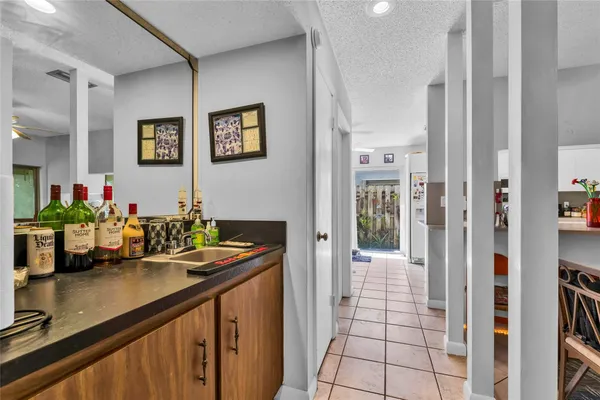 a view of a hallway with dining area