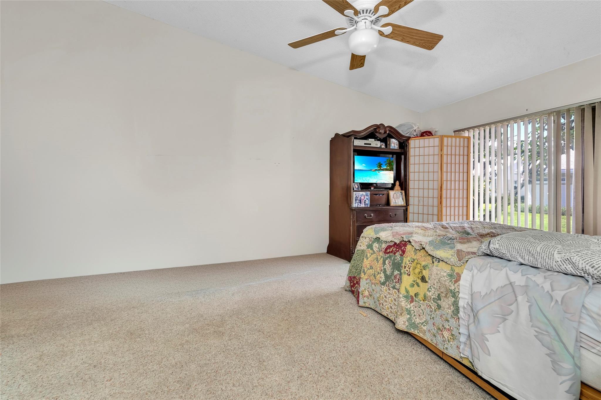 22349 Treetop Circle Boca Raton, FL 33433 - Photo 14 of 36 a bedroom with a bed and window