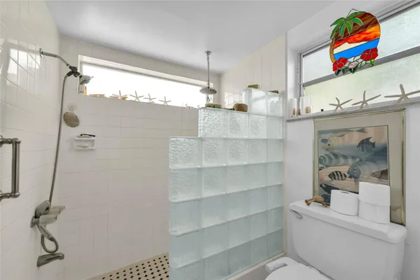 a bathroom with a sink a vanity and a mirror