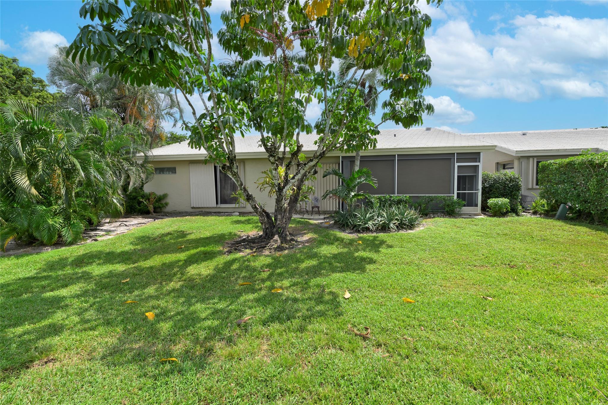 22349 Treetop Circle Boca Raton, FL 33433 - Photo 25 of 36 a view of backyard of house with green space