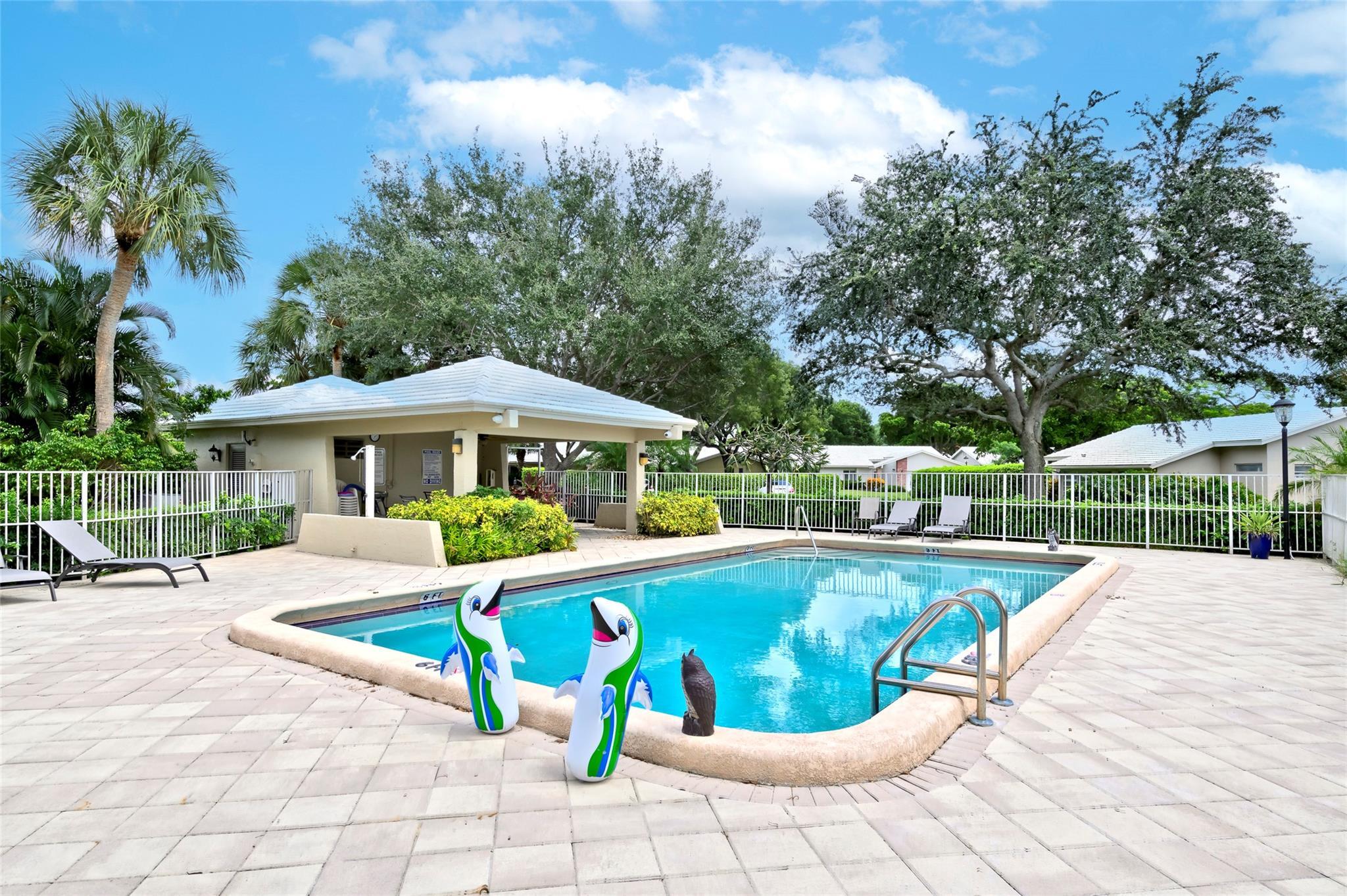 22349 Treetop Circle Boca Raton, FL 33433 - Photo 36 of 36 a view of a swimming pool with a patio