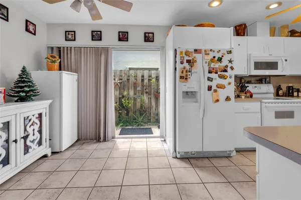 a kitchen with stainless steel appliances a refrigerator and a stove top oven