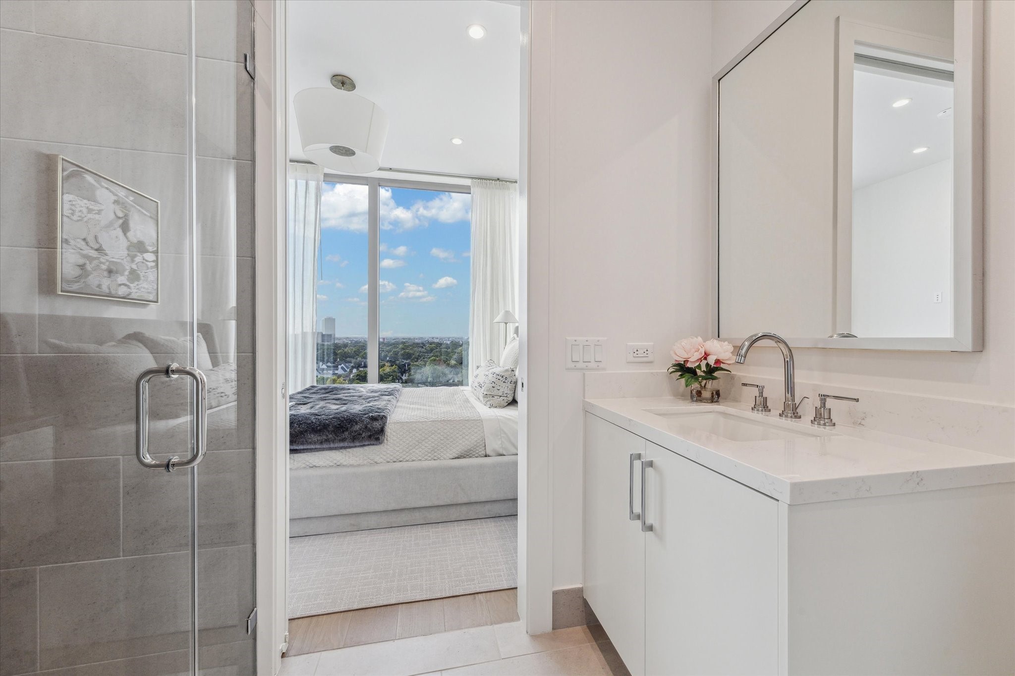 5656 San Felipe Street, Unit 1205 Houston, TX 77056 - Photo 43 of 45 a bathroom with a tub sink and mirror