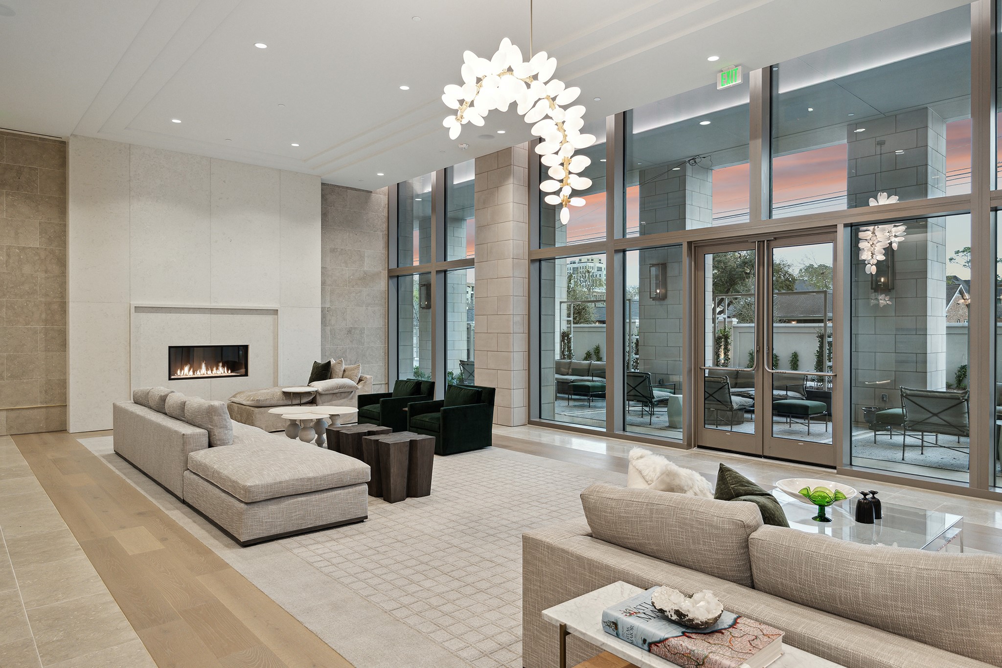5656 San Felipe Street, Unit 1205 Houston, TX 77056 - Photo 4 of 45 a living room with furniture a fireplace and a chandelier