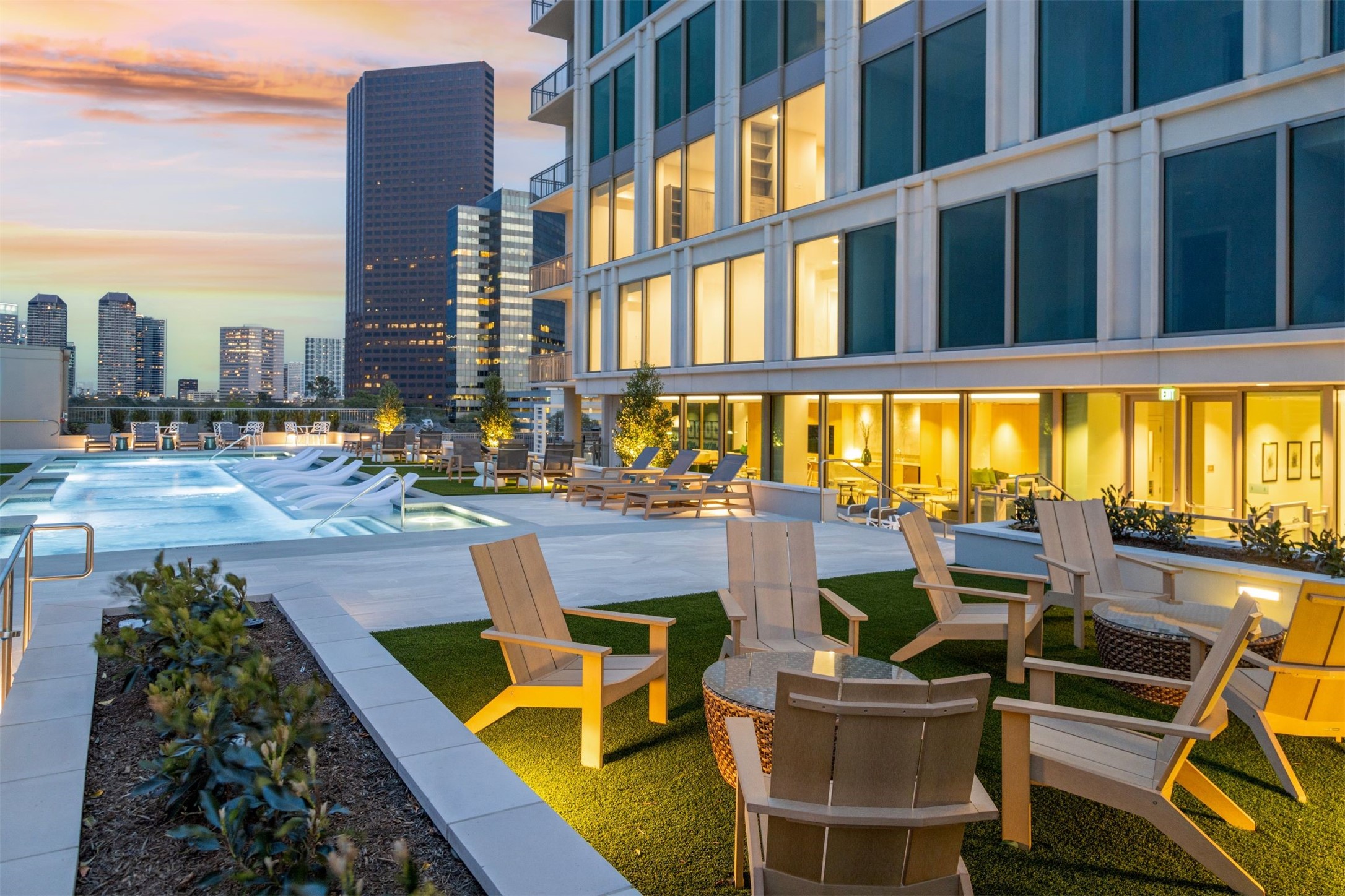 5656 San Felipe Street, Unit 1205 Houston, TX 77056 - Photo 13 of 45 a view of a swimming pool with outdoor seating and a floor to ceiling window