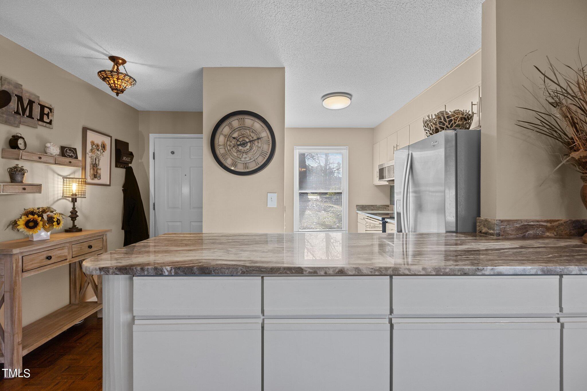 2426 Mapleton Lane Raleigh, NC 27613 - Photo 13 of 30 Kitchen Island with cabinet space