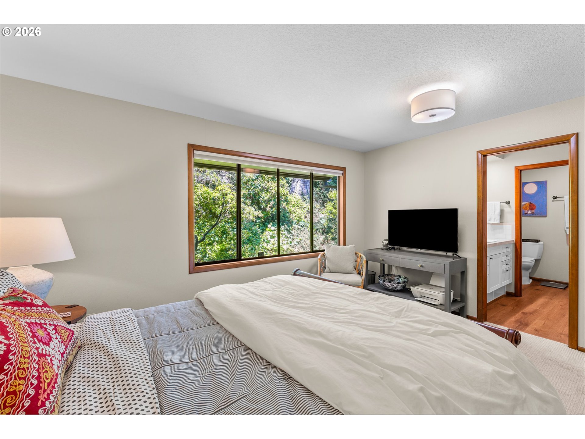 77 Condolea Way Lake Oswego, OR 97035 - Photo 12 of 25 a bedroom with a bed and a flat screen tv