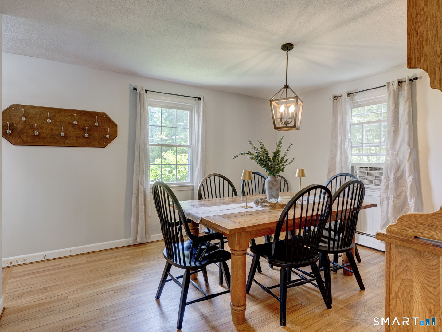 39 Freedom Drive Canton, CT 06019 - Photo 9 of 37 a view of a dining room with furniture window and wooden floor