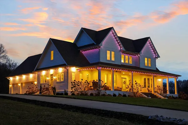 a front view of a house with a yard