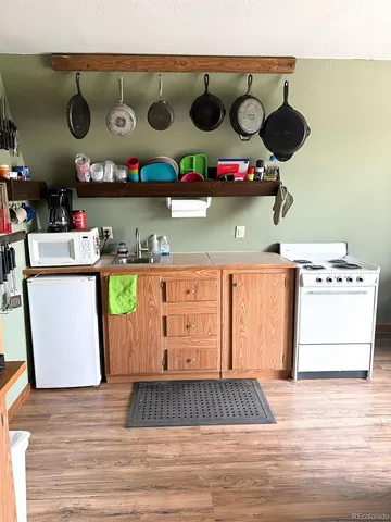 a kitchen with a stove and cabinets