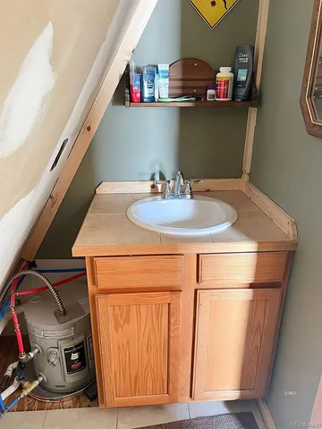 a bathroom with a sink and a mirror