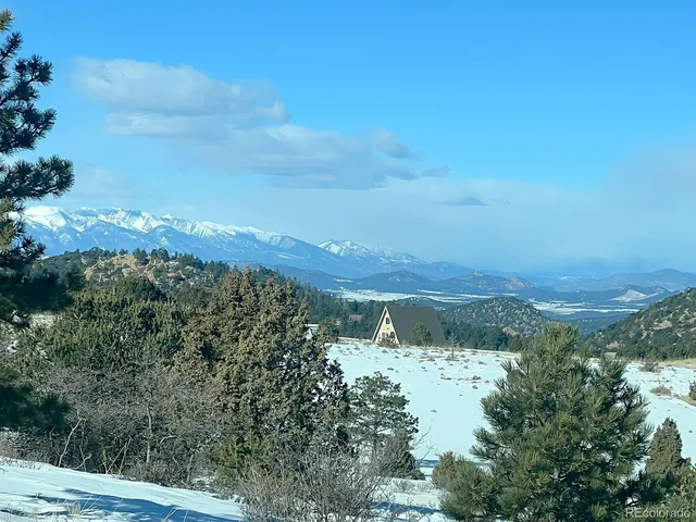 a view of a city with mountains in the background