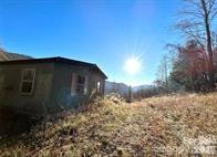 108 Lanning Road Clyde, NC 28721 - Photo 1 of 10 a backyard of a house with lots of green space