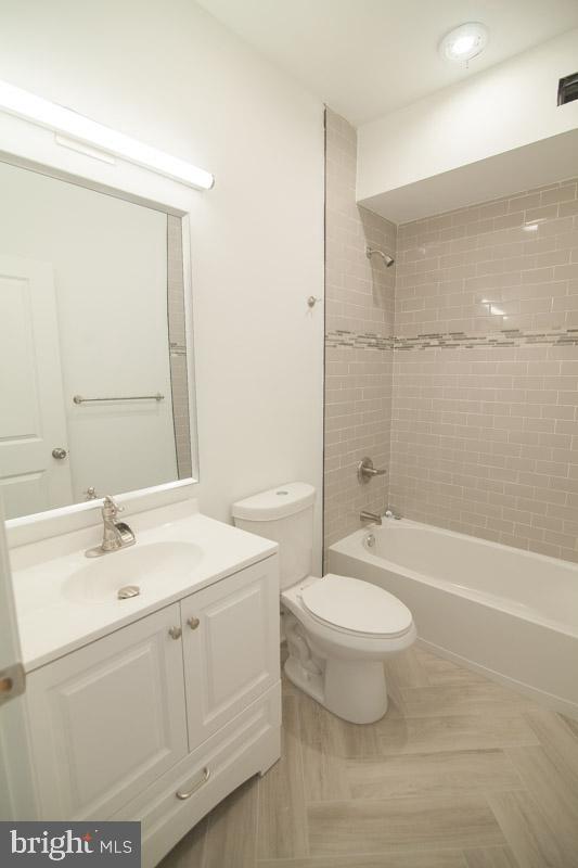 1829 North 33rd Street, Unit 1 Philadelphia, PA 19121 - Photo 2 of 9 a bathroom with a sink a toilet and shower