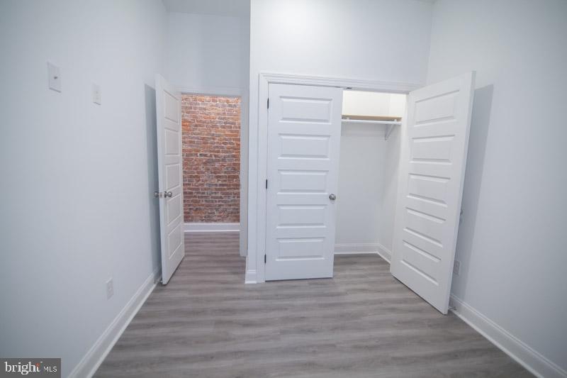 1829 North 33rd Street, Unit 1 Philadelphia, PA 19121 - Photo 4 of 9 a view of walk in closet with empty racks