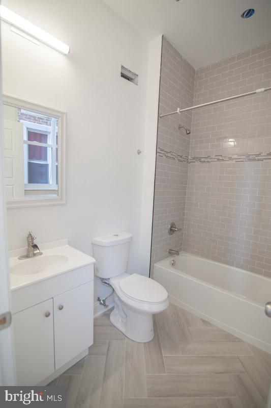 1829 North 33rd Street, Unit 1 Philadelphia, PA 19121 - Photo 5 of 9 a bathroom with a sink a toilet and a bathtub