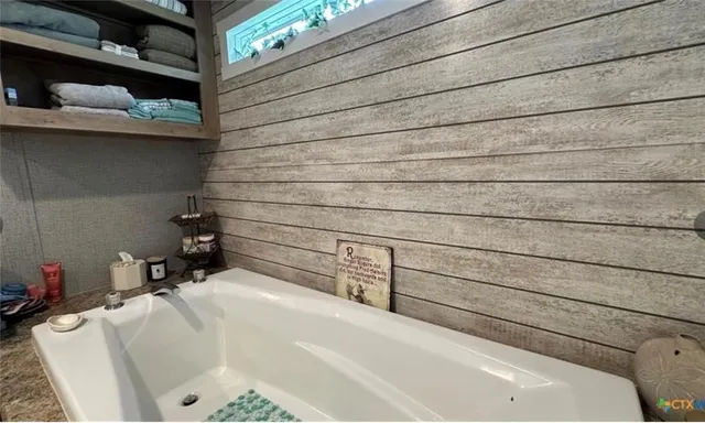 a bathroom with a bathtub