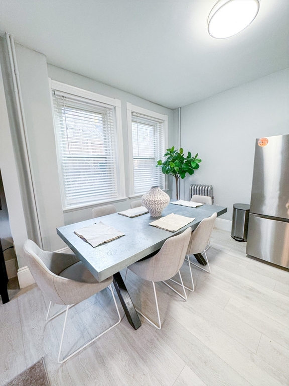 636 Washington Street, Unit 1 Brookline, MA 02446 - Photo 6 of 17 a view of a dining room with furniture