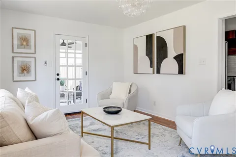 a living room with furniture and white walls