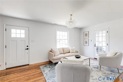 a kitchen with stainless steel appliances granite countertop a sink a stove a refrigerator a microwave and cabinets