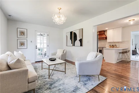 a kitchen with stainless steel appliances granite countertop a sink a stove and cabinets