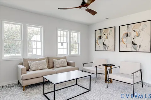a view of a living room and dining room