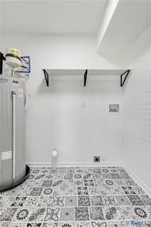 a workspace with wooden floor and a window