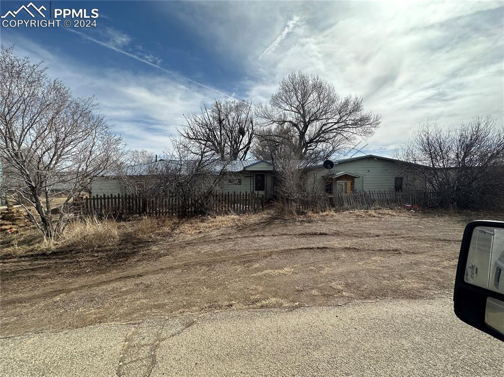 a backyard of a house with large trees